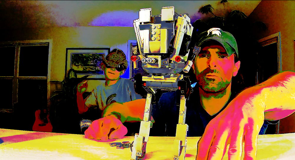 LEGO Master Builder Robert looking at the AT-ST with Kyle dancing in the background