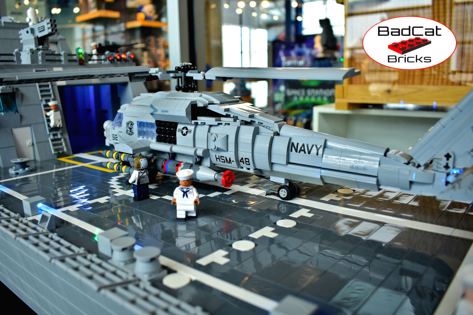 LEGO USS Cleveland pic 7 LEGO MH-60R Seahawk on the flight deck of LEGO USS Cleveland with minifigure sailors and flight crew.